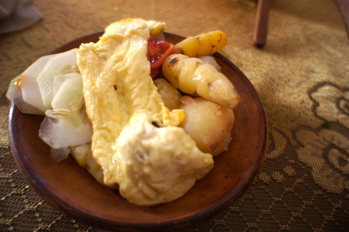A plate of boiled potatoes and fried cheese during a Lake Titicaca Homestay.