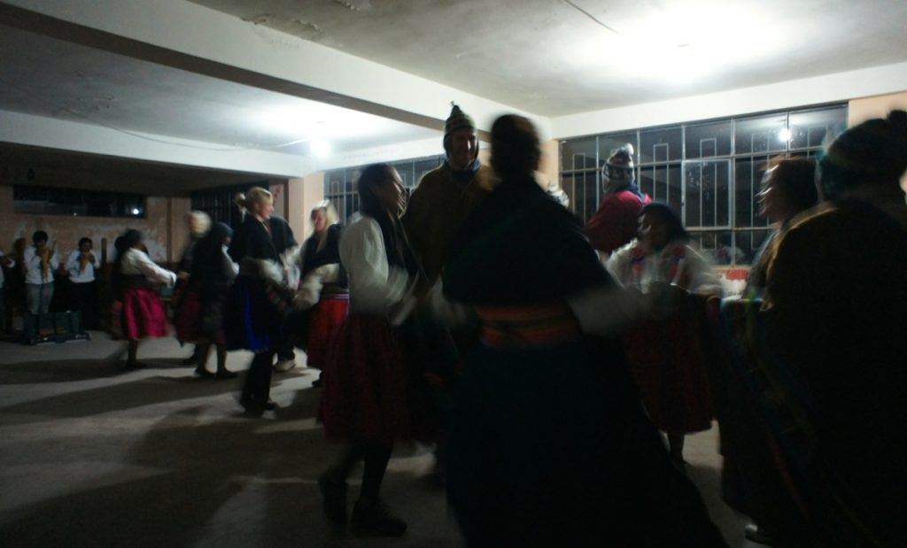 dancing in traditional Quechua clothes during a Lake Titicaca homestay