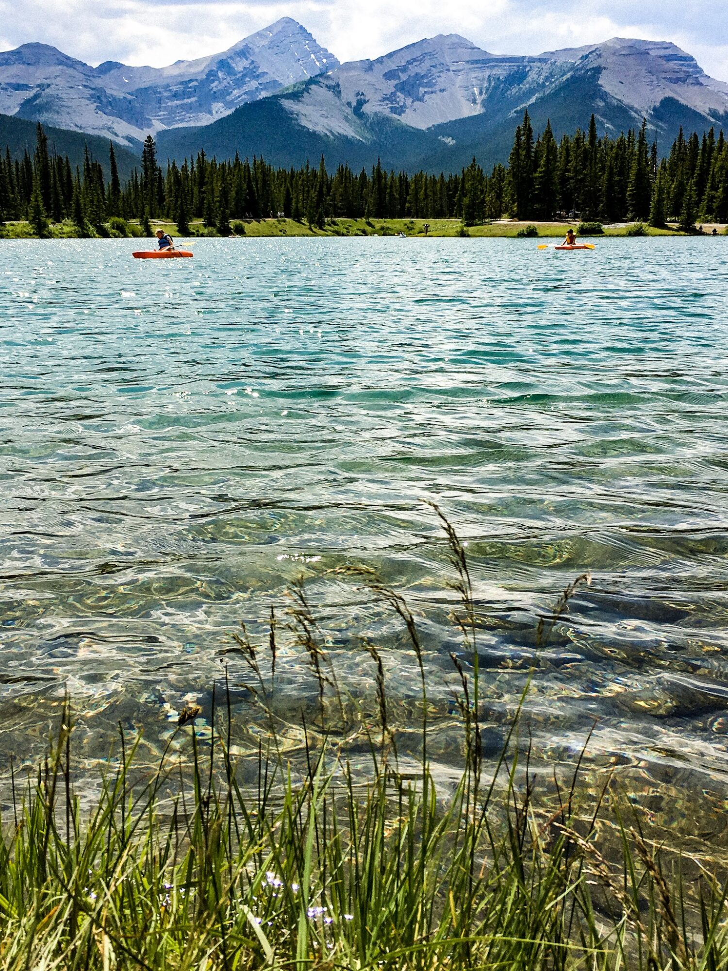 people paddling on forget me not pond in alberta