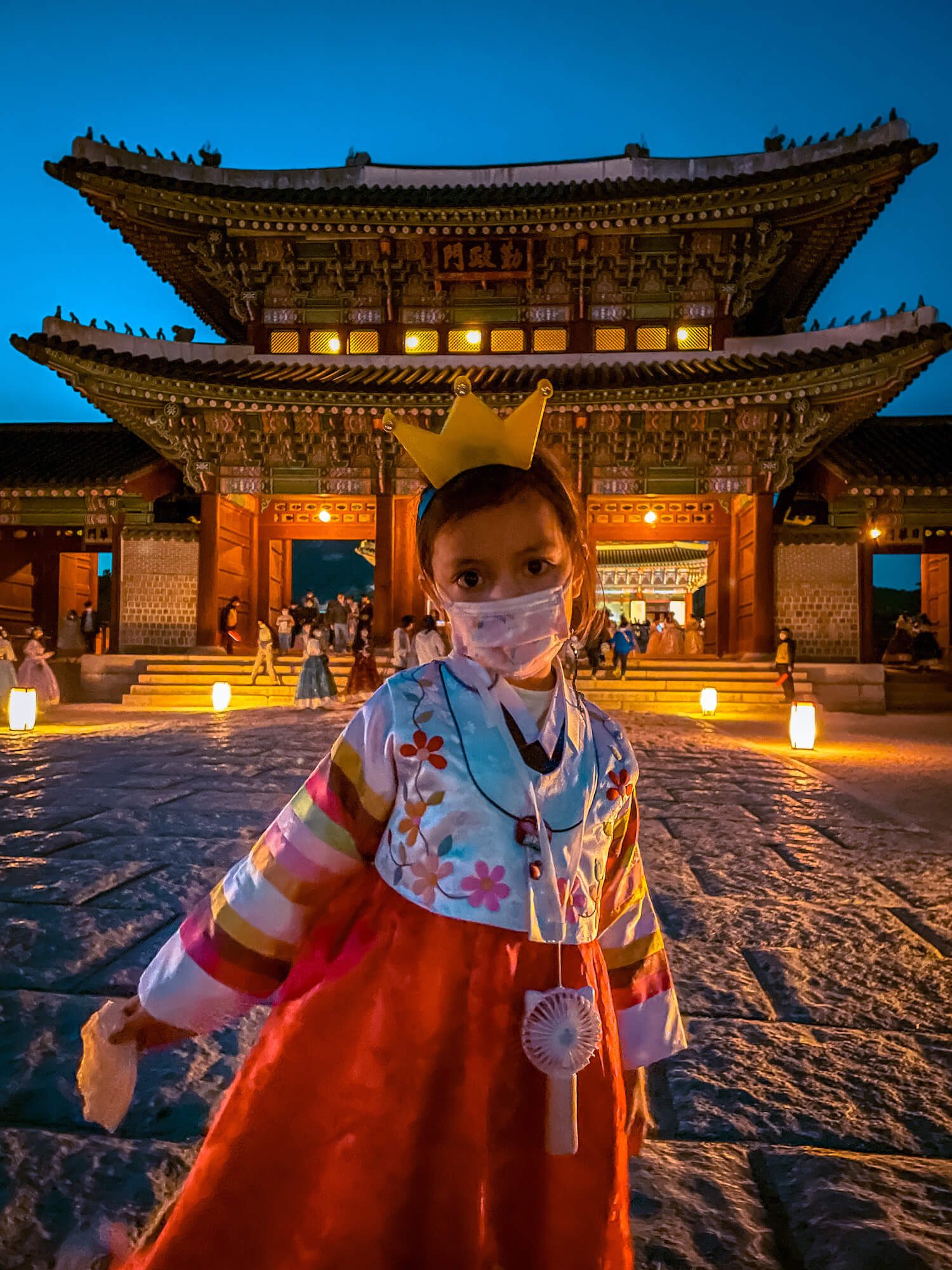 korea in april | child in korean hanbok at gyeongbokgung palace at night