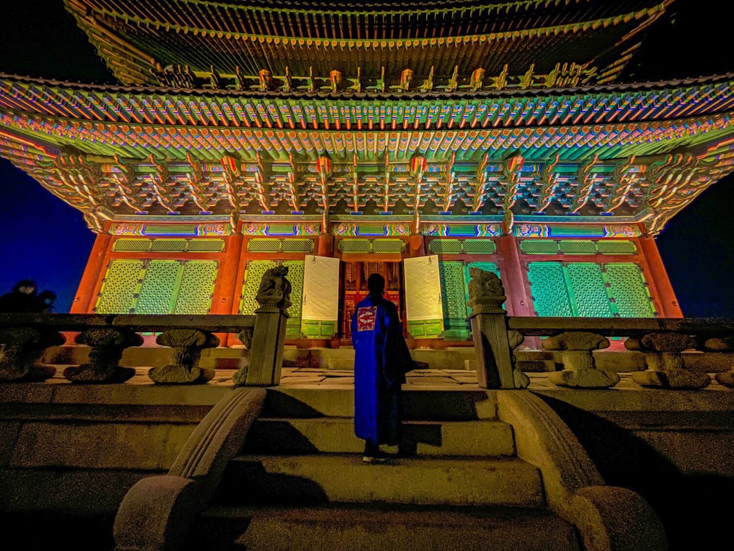renting a men's hanbok in seoul at gyeongbokgung palace at night