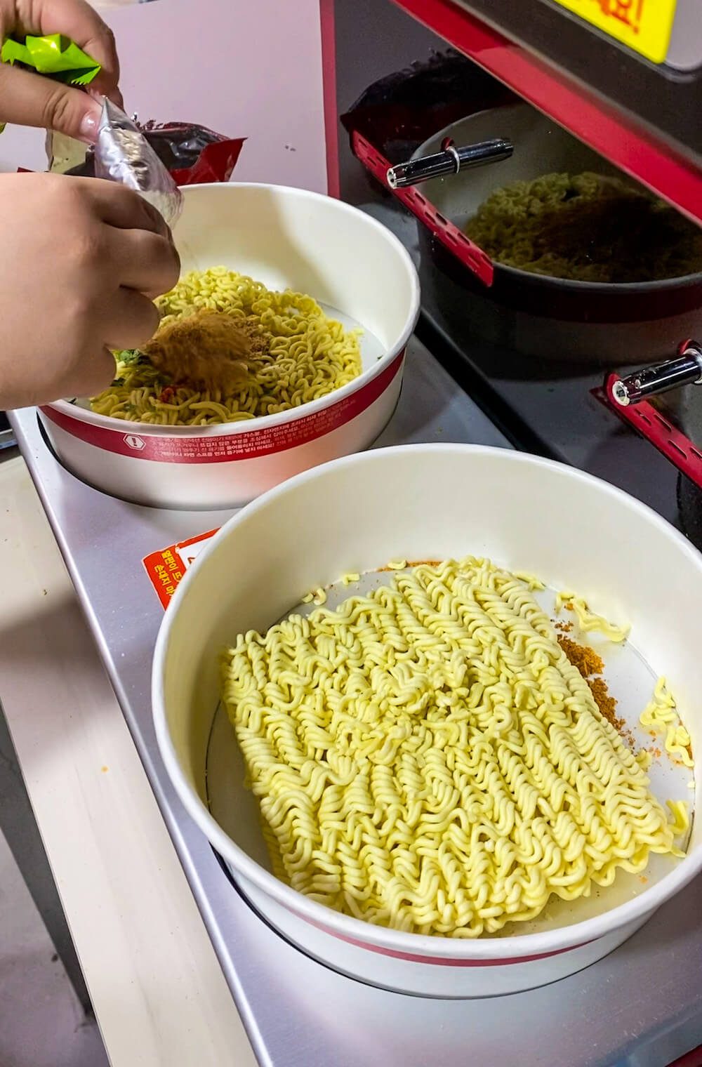 cooking ramen at the Korean convenience store